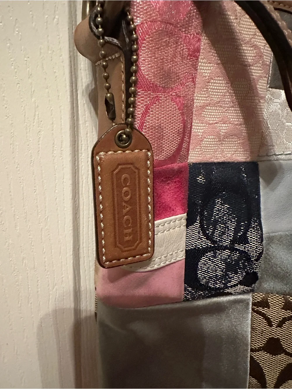 Coach Patchwork Signature Shoulder Bag with matching hat.